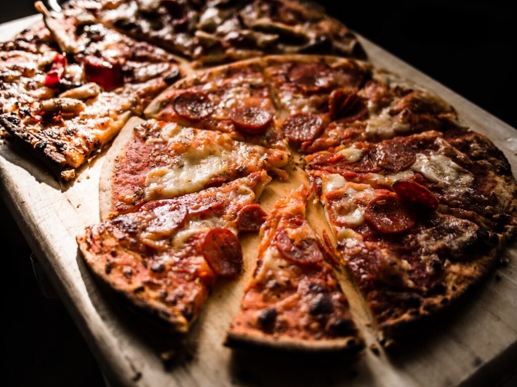 A table full of pizza. Just because you go for a run doesn't mean you can eat anything you want and still lose weight.