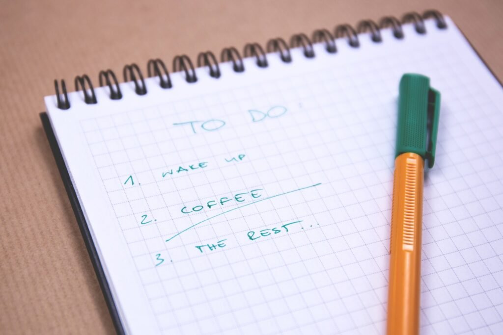 Close up of a notebook and a pencil, with a to do list. This is a great way to make running an effective habit.