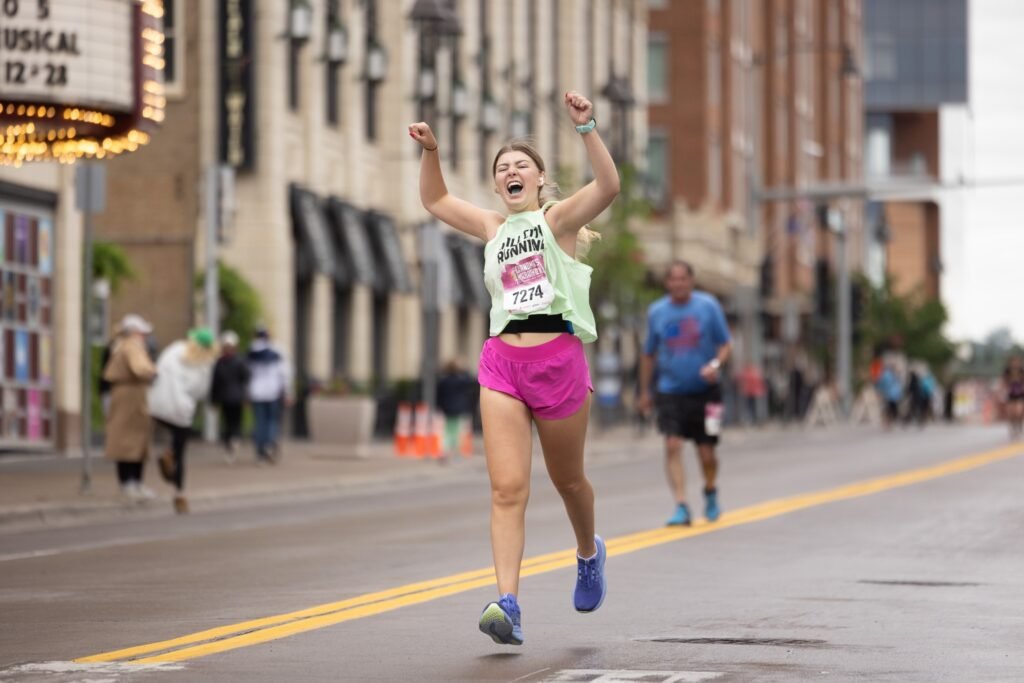 Woman running Grandma's marathon