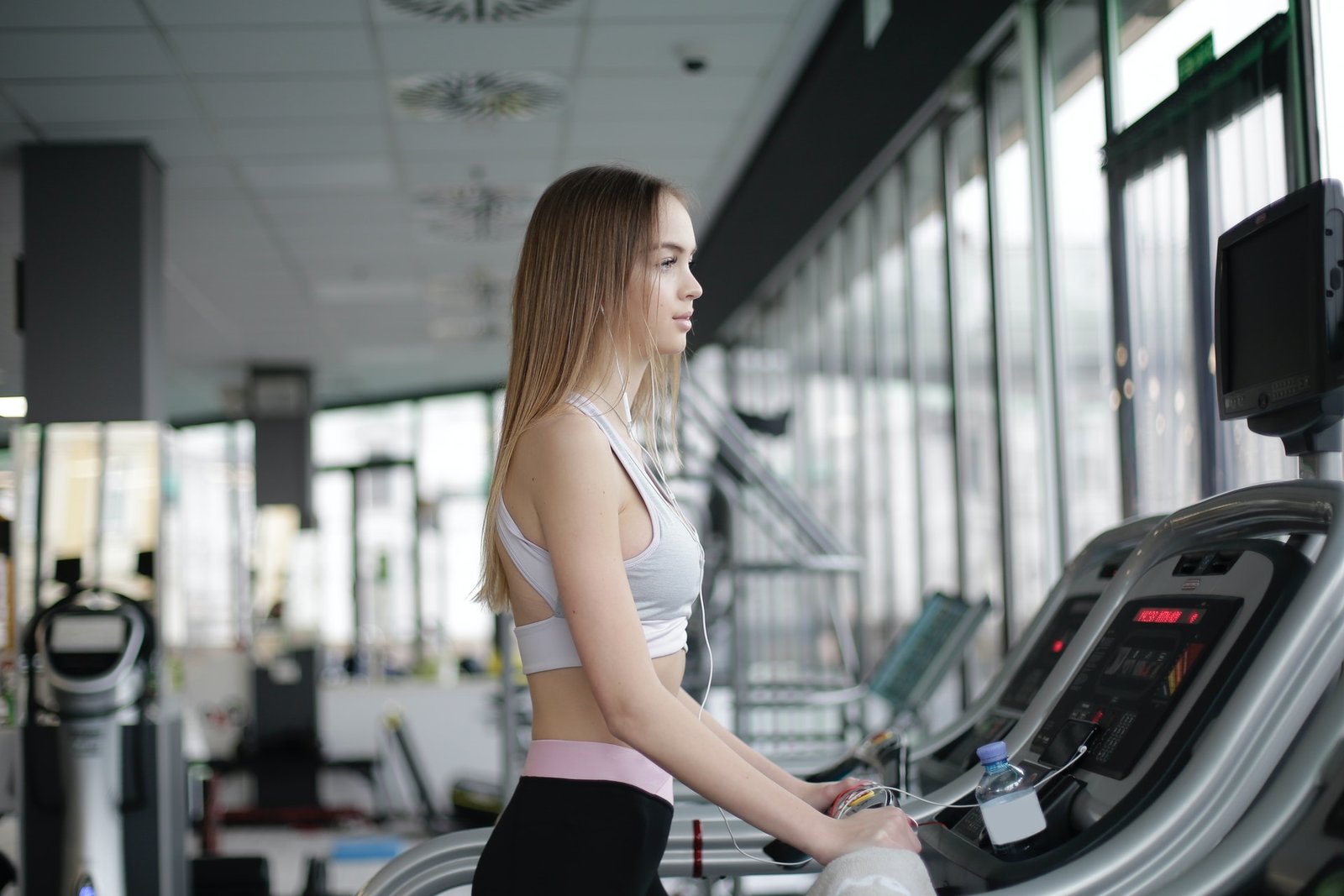 A woman on a treadmill at the gym. Here are the five best treadmills under $500 for your home.