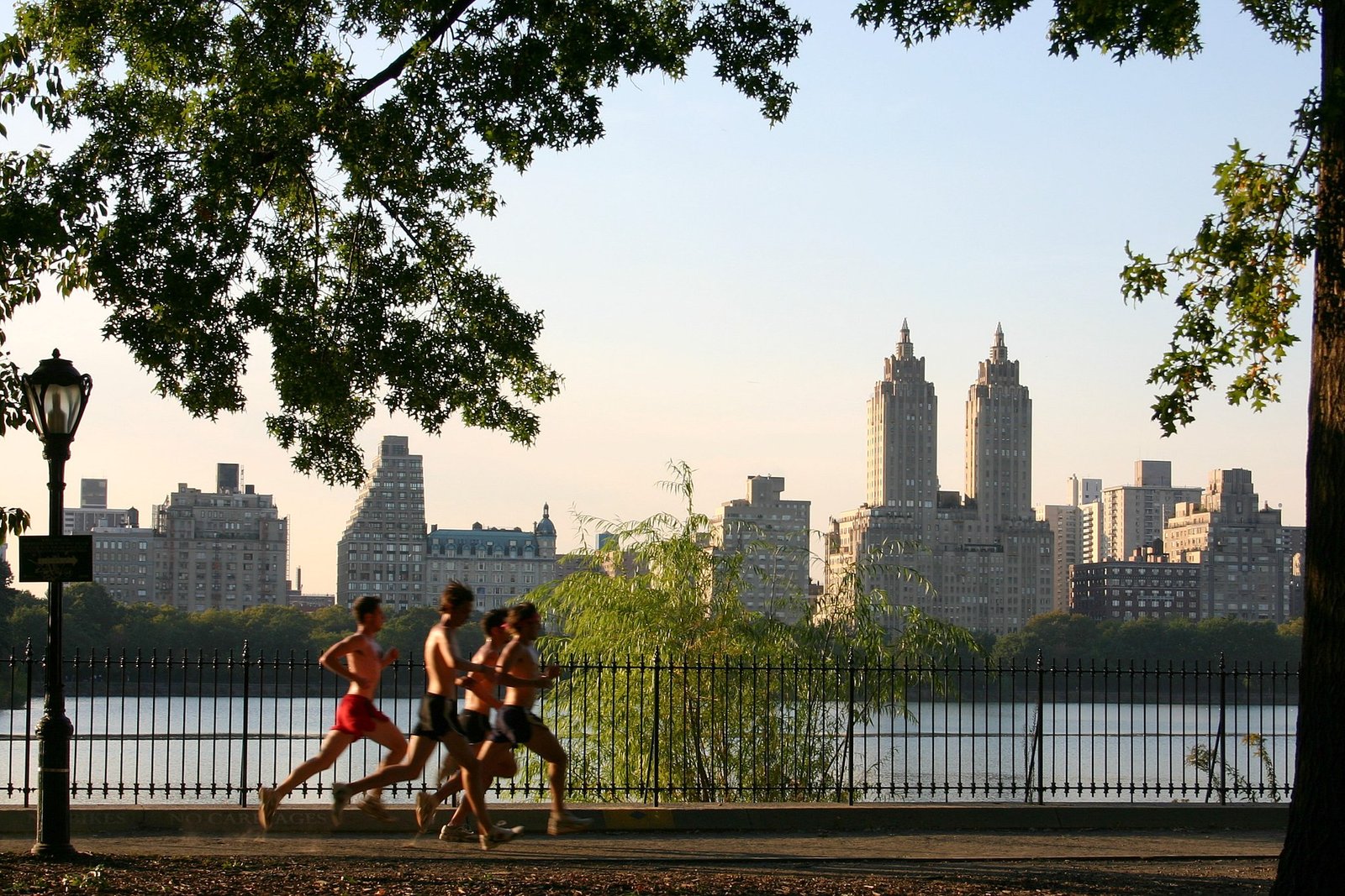 Runners jogging through Central Park in New York City.
