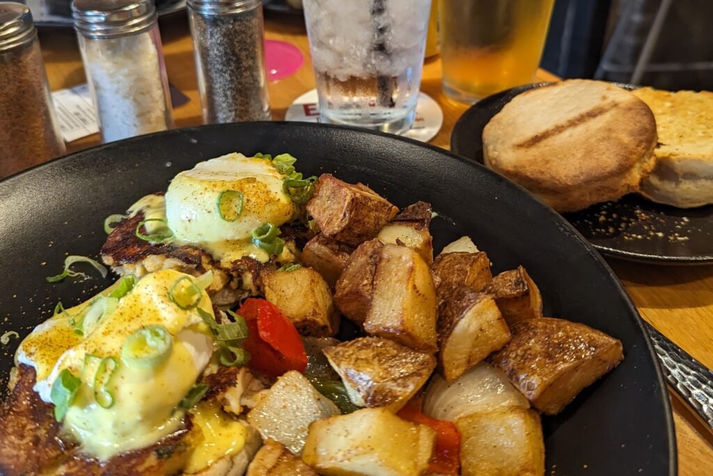 Brunch at NOLA - eggs benedict over crab cakes, with a biscuit on the side.