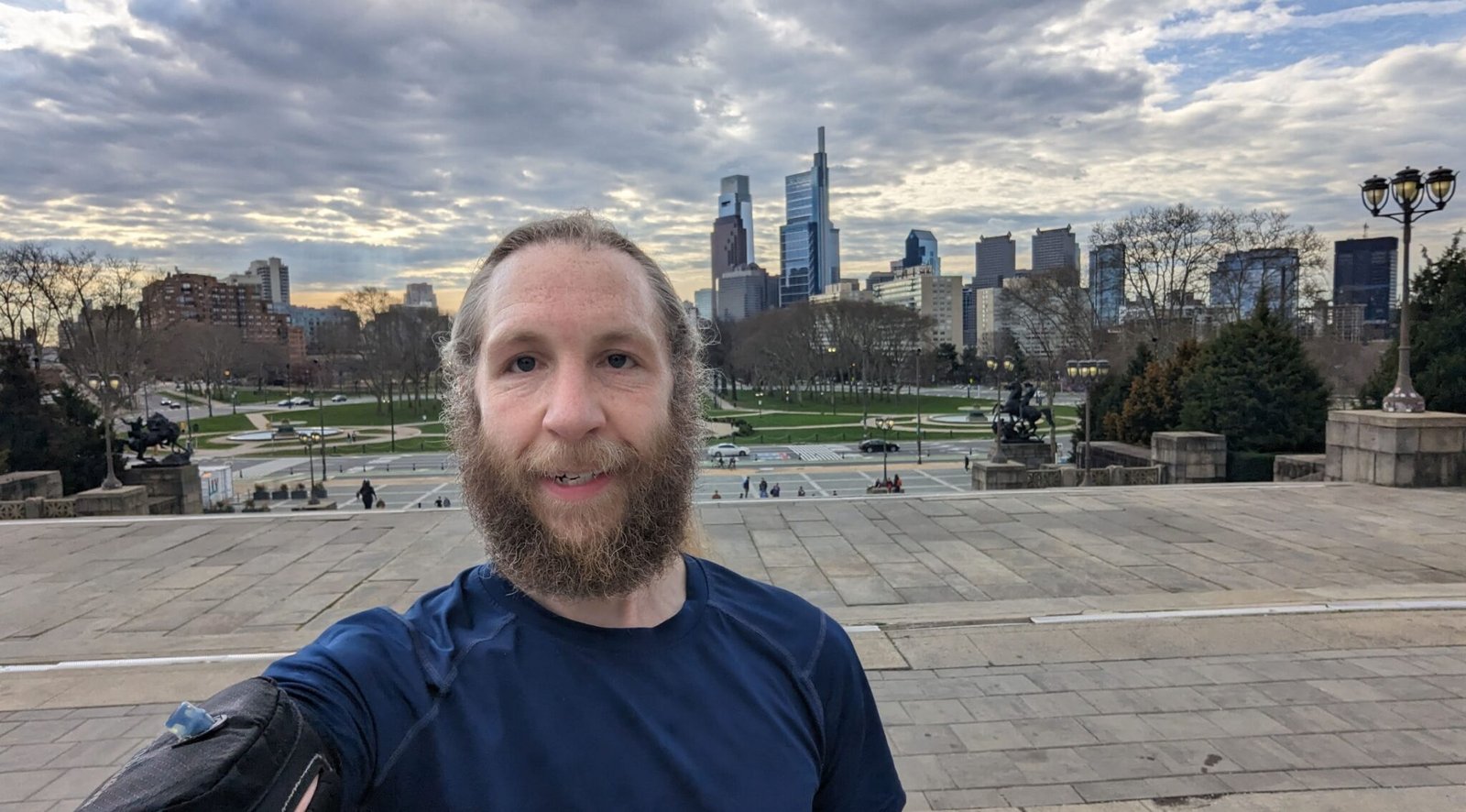 Me at the end of a 20 mile long run, training for the Jersey City Marathon. Taken at the top of the steps to the Philly art museum, with the city skyline in the background.
