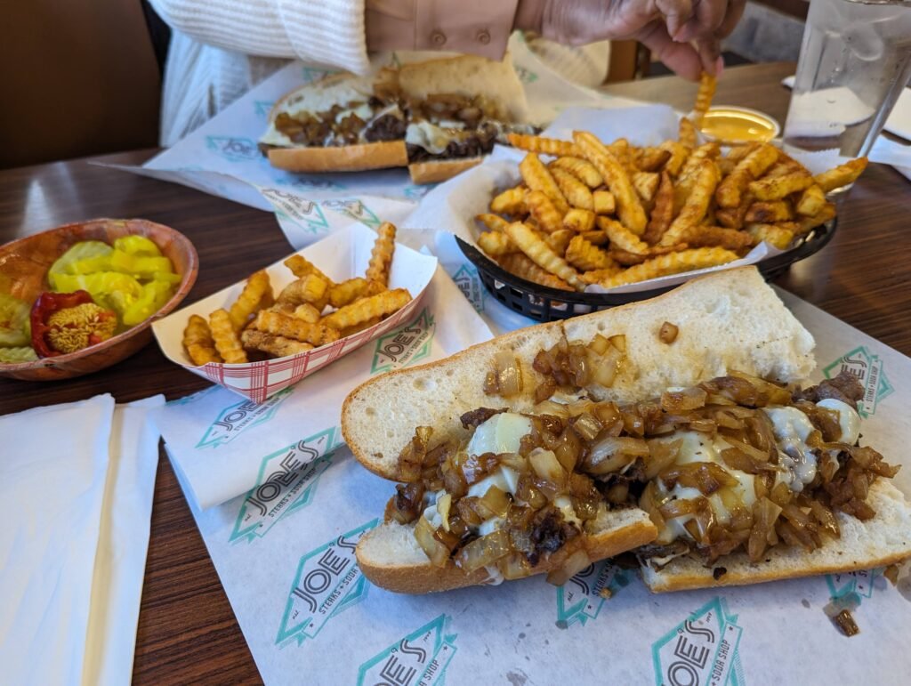 A cheesesteak and french fries from Joes Steak and Soda Shop - the perfect recovery meal.