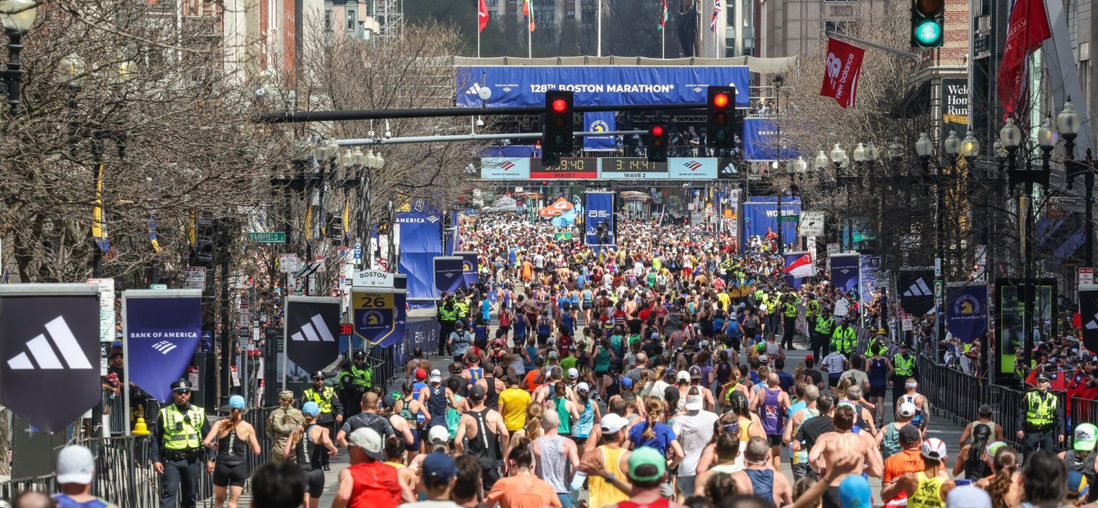 The finish line at the 2024 Boston Marathon, with a large number of runners crossing the finish.