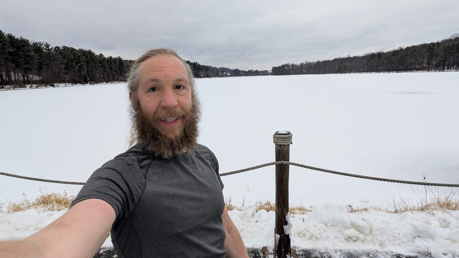 A selfie of me on my long run, with the frozen Reservoir behind me